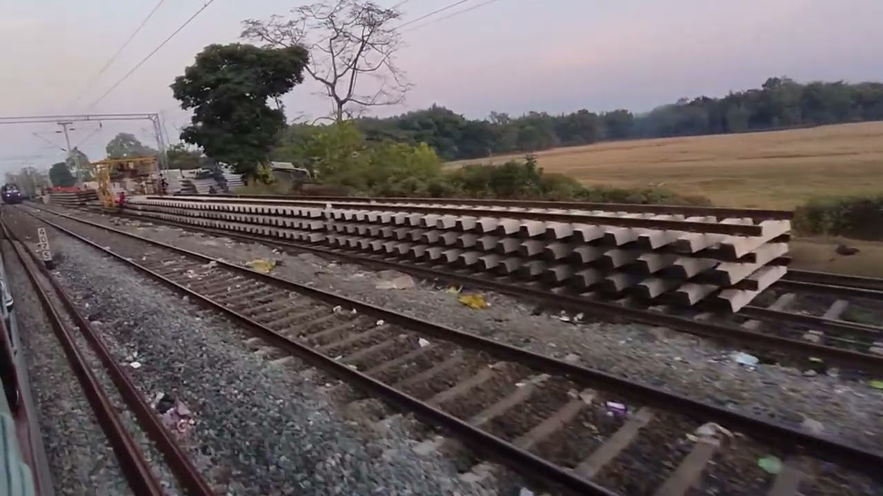 New Tinsukia passenger slowly moving towards Namti Ali railway station Assam at Evening time.
