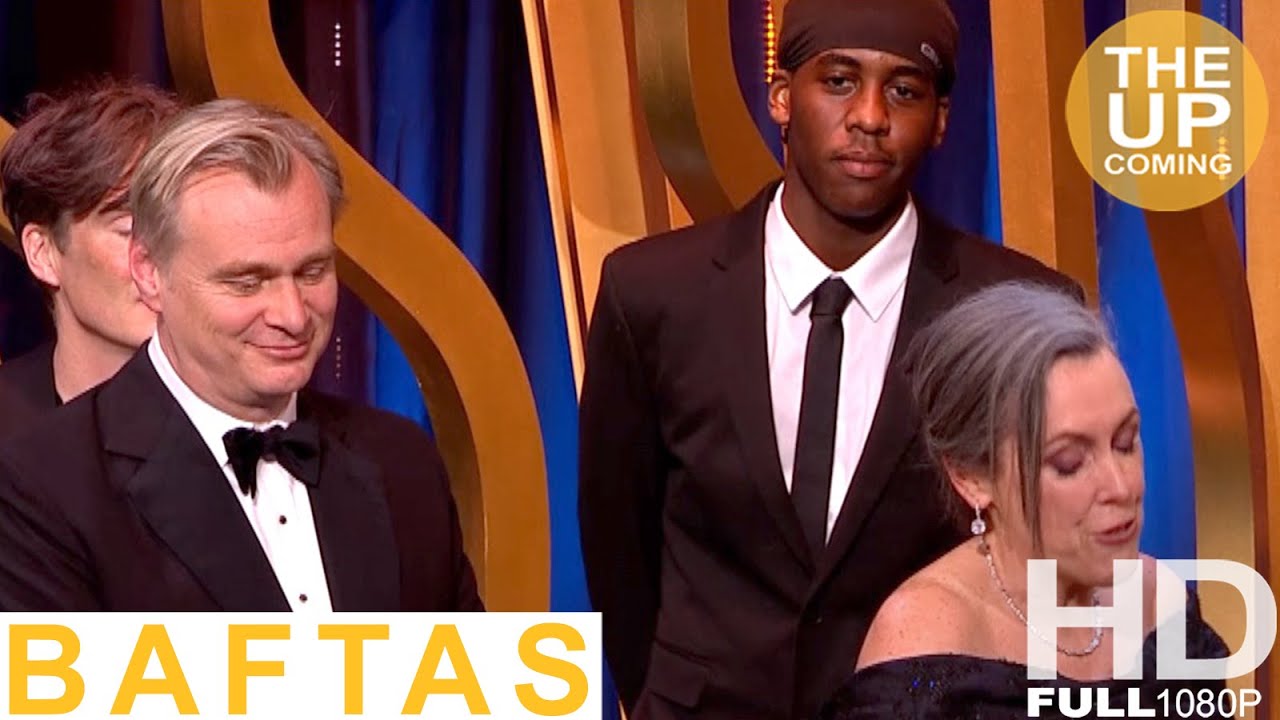 Prankster Lizwani join Oppenheimer team on stage at BAFTAs for Best Film award speech Nolan, Murphy