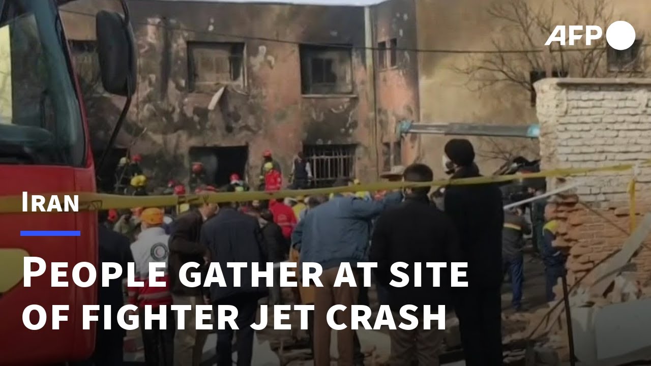 People gather at site of an Iranian fighter jet crash | AFP