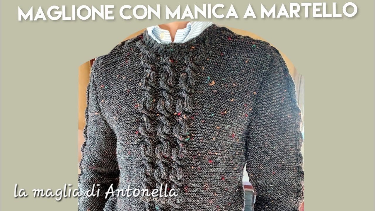maglione con le trecce e manica a martello