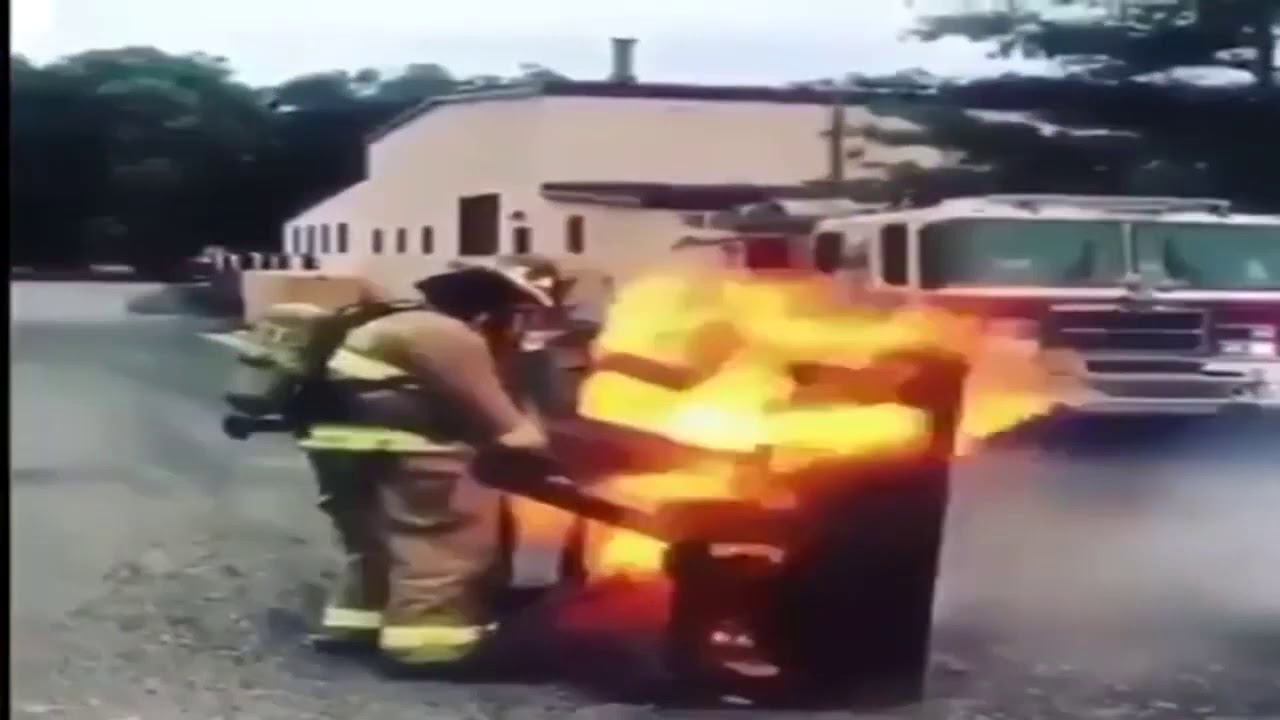 man playing still d r e on a burning piano   fire brigade man playing still d r e on a piano