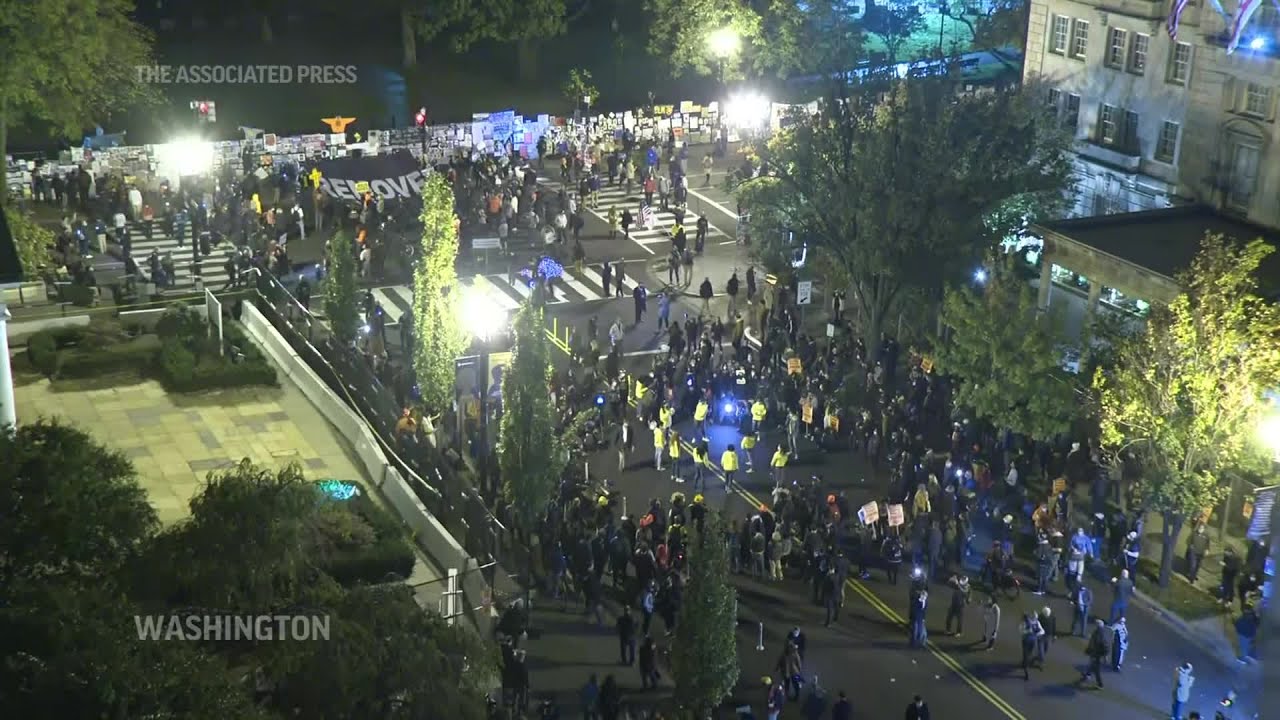 Protest banners unfurled at DC's BLM Plaza