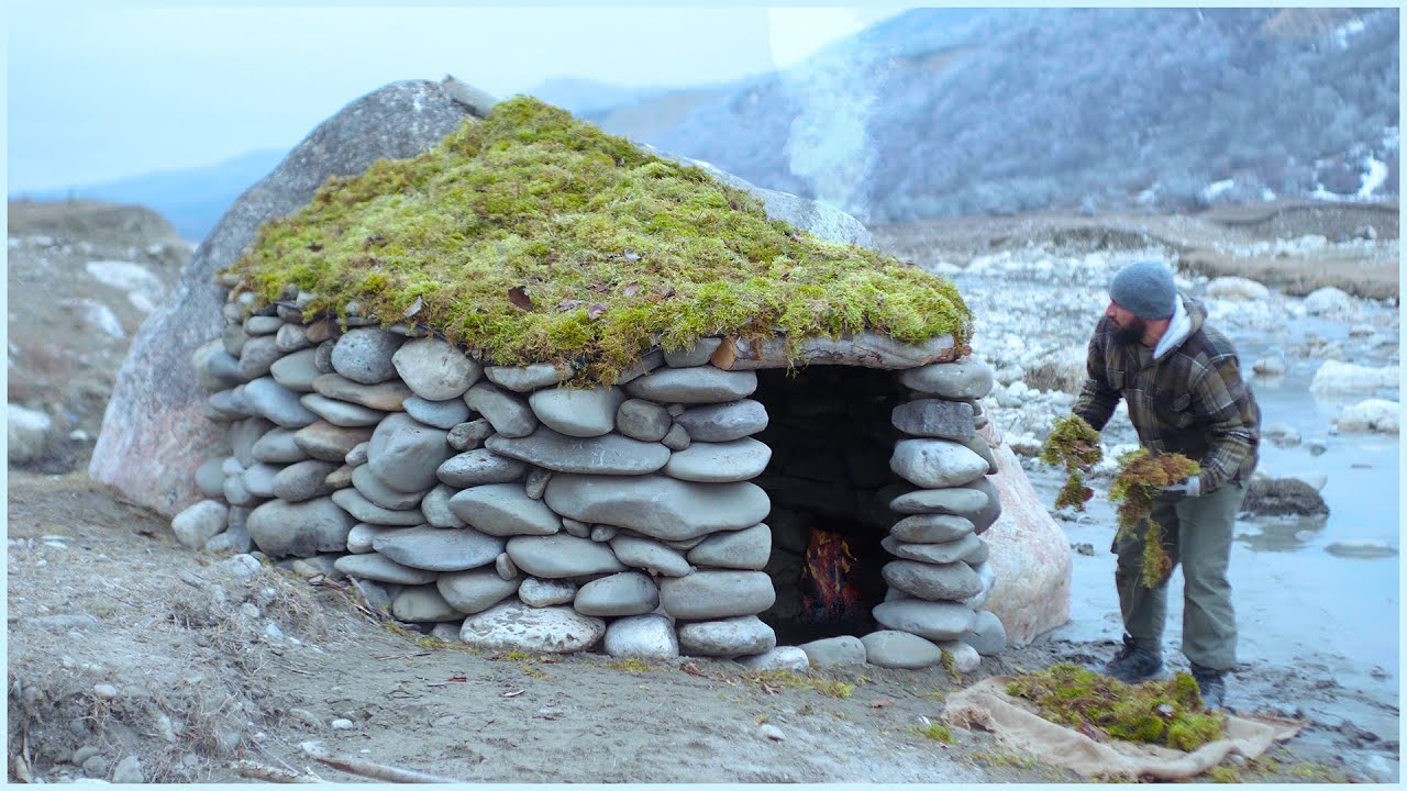 I Built a COZY Stone River Shelter with a Fireplace and Moss Roof!