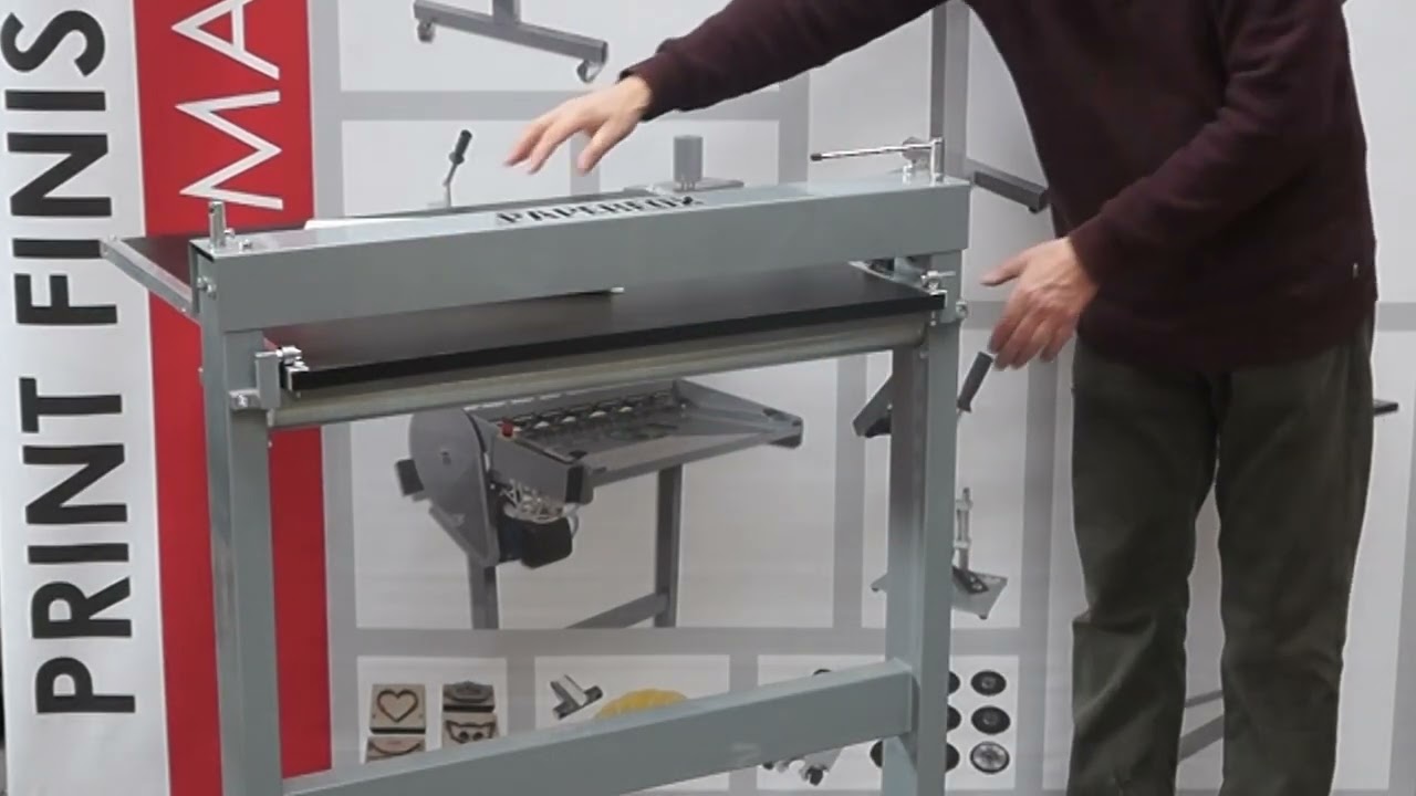 Setting up the Paperfox H-1 cylinder die cutting machine.