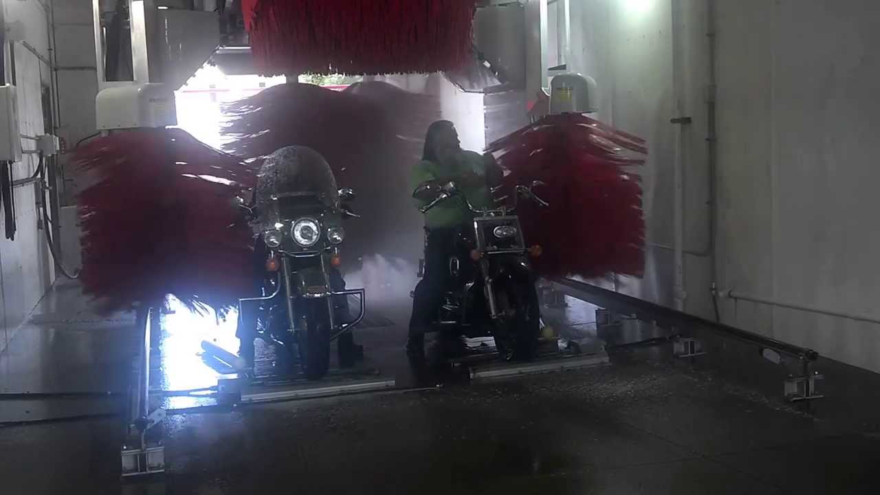 Motorcycles in a car wash - with brushes