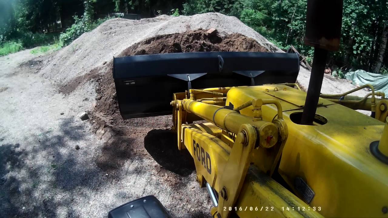 Moving some gravel with Ford 550 backhoe