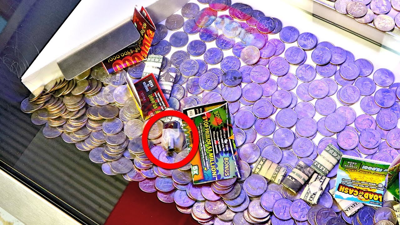 Why Is There a Key In This Real Money Coin Pusher?