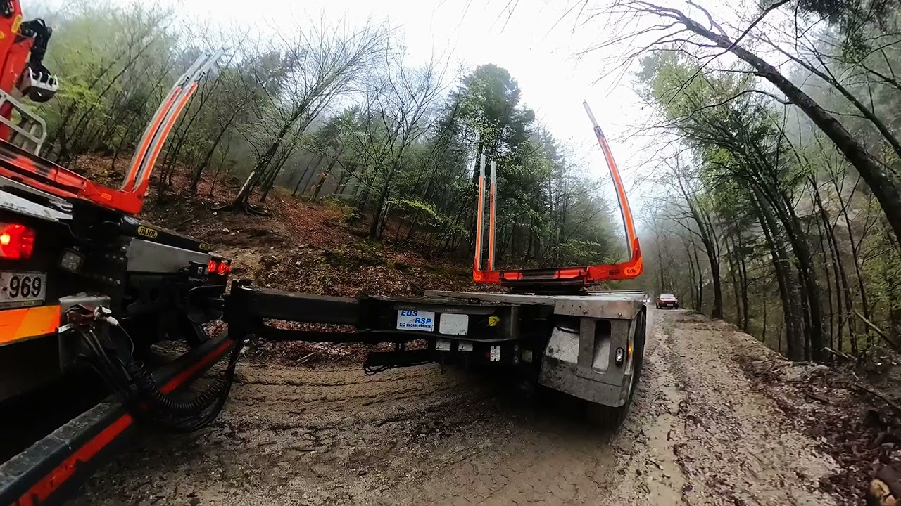 Mercedes Arocs 3351 6x6 timber truck in forest road