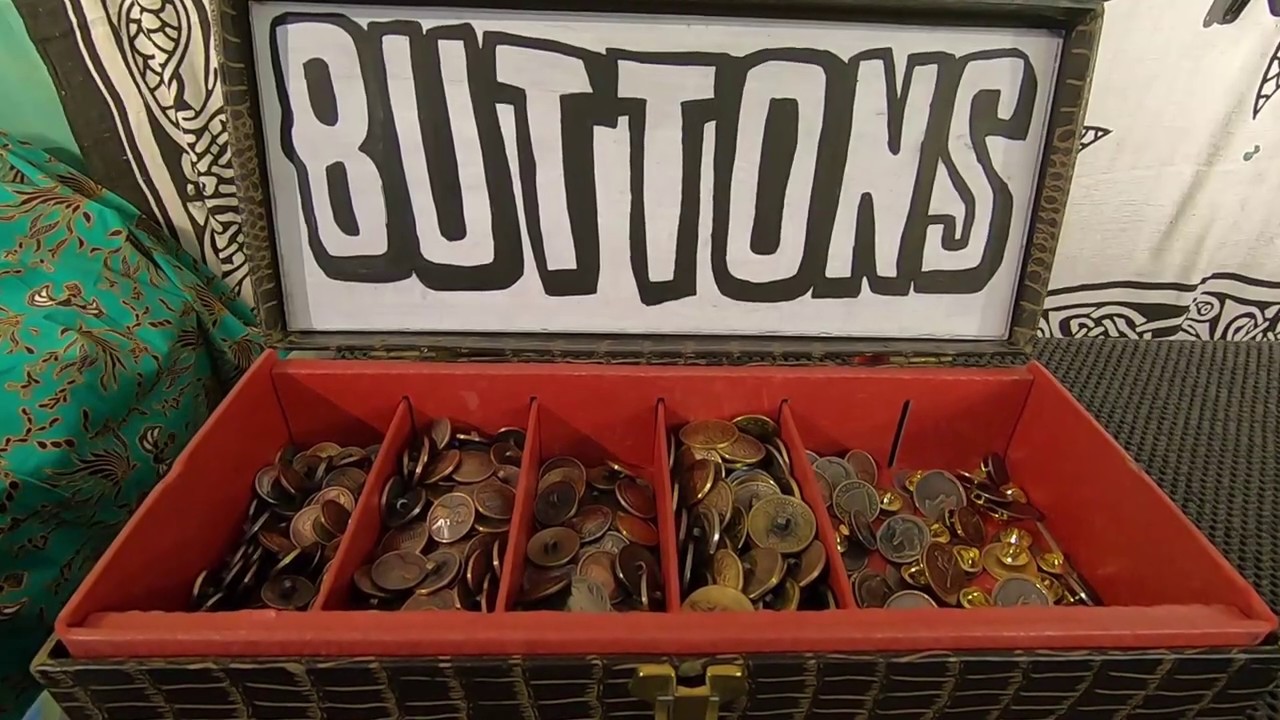 Buttons made from coins and tokens (product display) and how to sew a shank button.