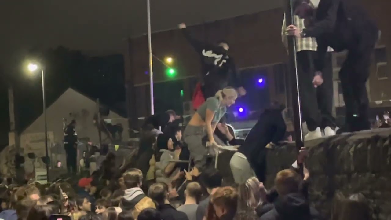 People climb over the wall to get into Lakota