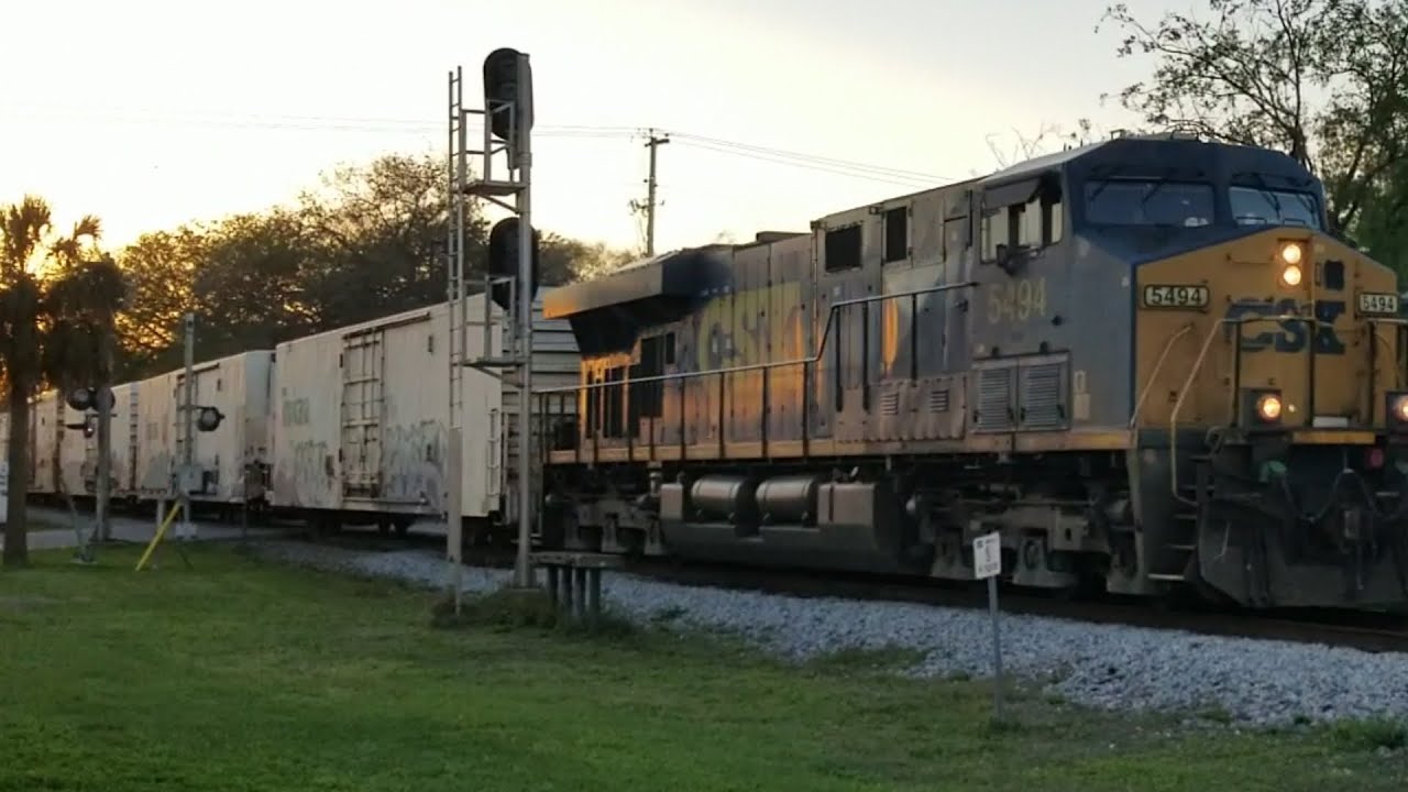 CSX DC power leads 250 axle intermodal train over double diamond (fast). (with Tropicana juice train