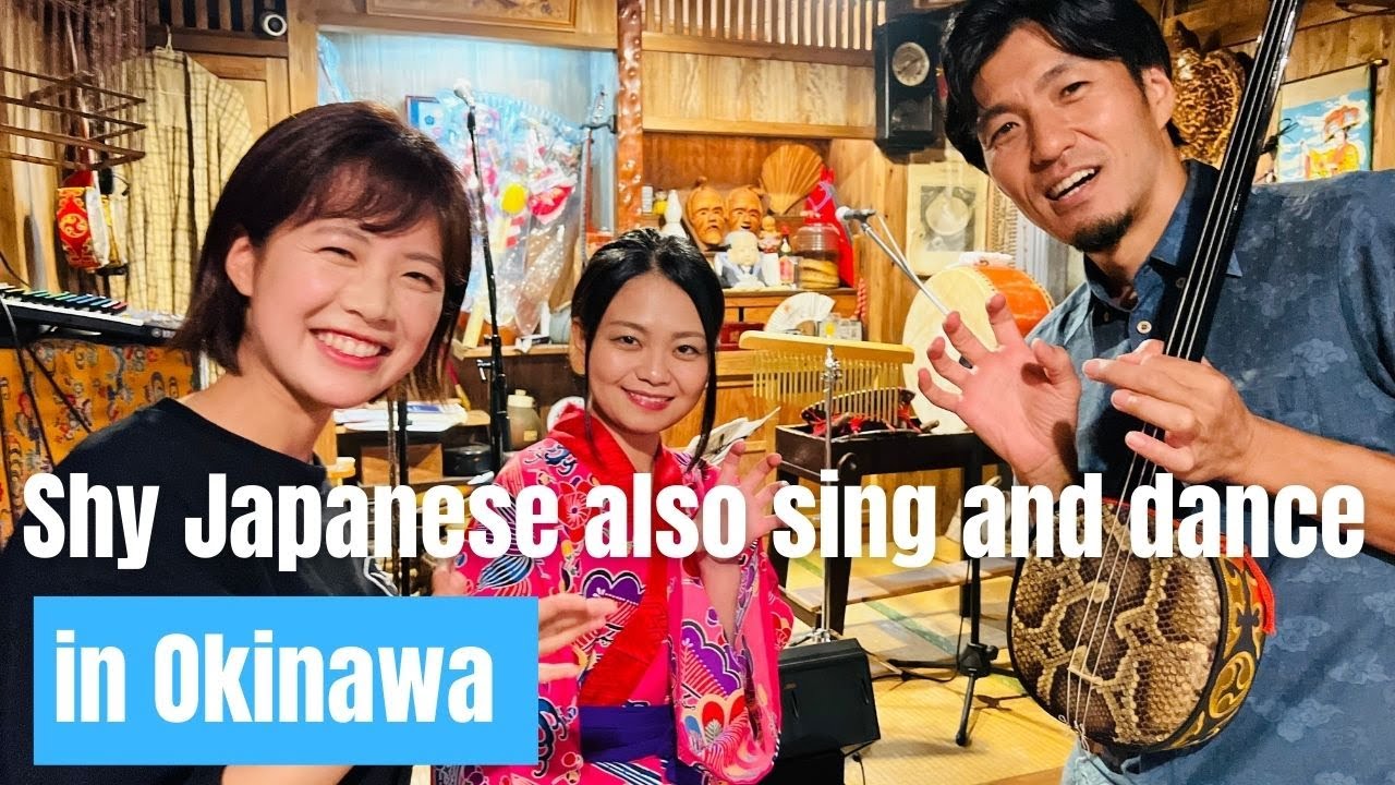 A cute girl and a cool man singing Okinawan folk songs