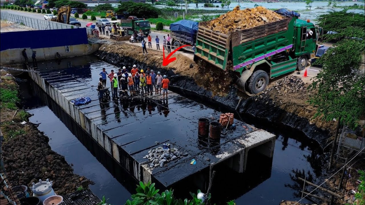 Incredible New Project! A Dump Truck Pouring Soil Rock to fill a Concrete Pipe with Bulldozer pushed
