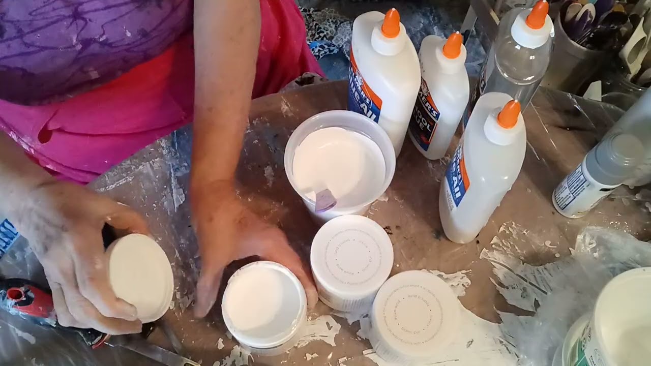 Mixing up satin enamel and glue and water for pouring medium
