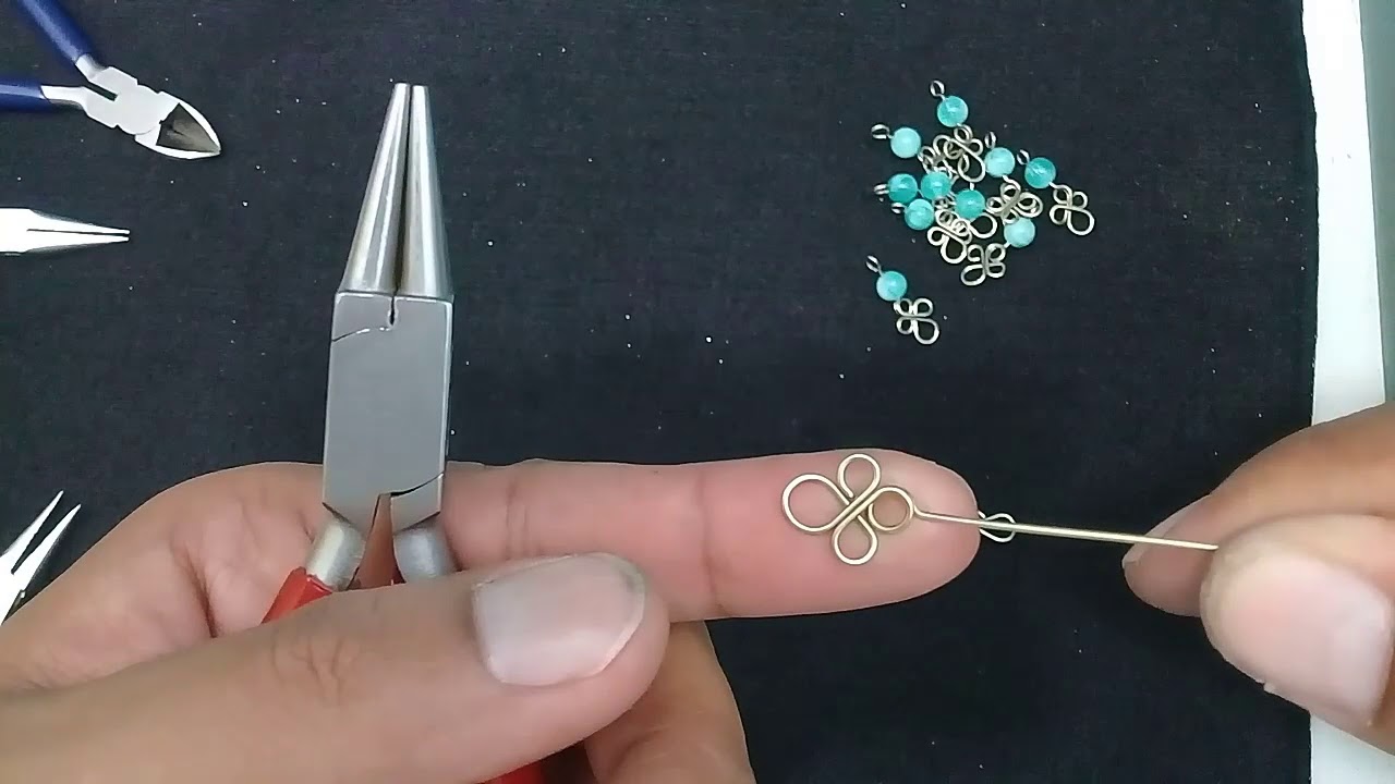 pulseira de trevo em arame alpaca com pingente