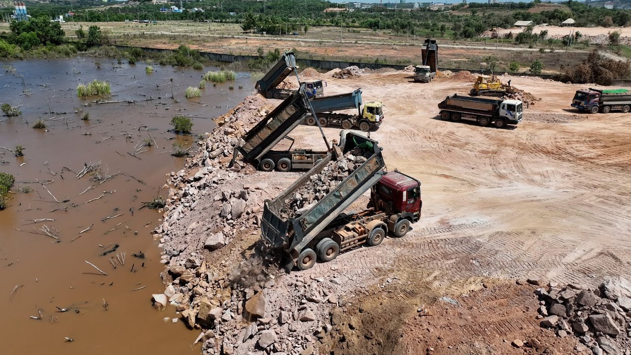 Incredible Large Process Develop Area , Bulldozer Pushing Big Stone Rock with Dump truck Unloading