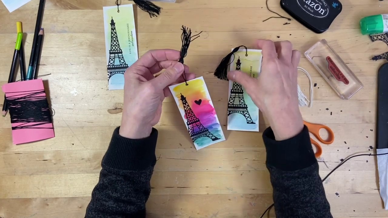 Make a tassel and attach in a clean fashion to a watercolored bookmark