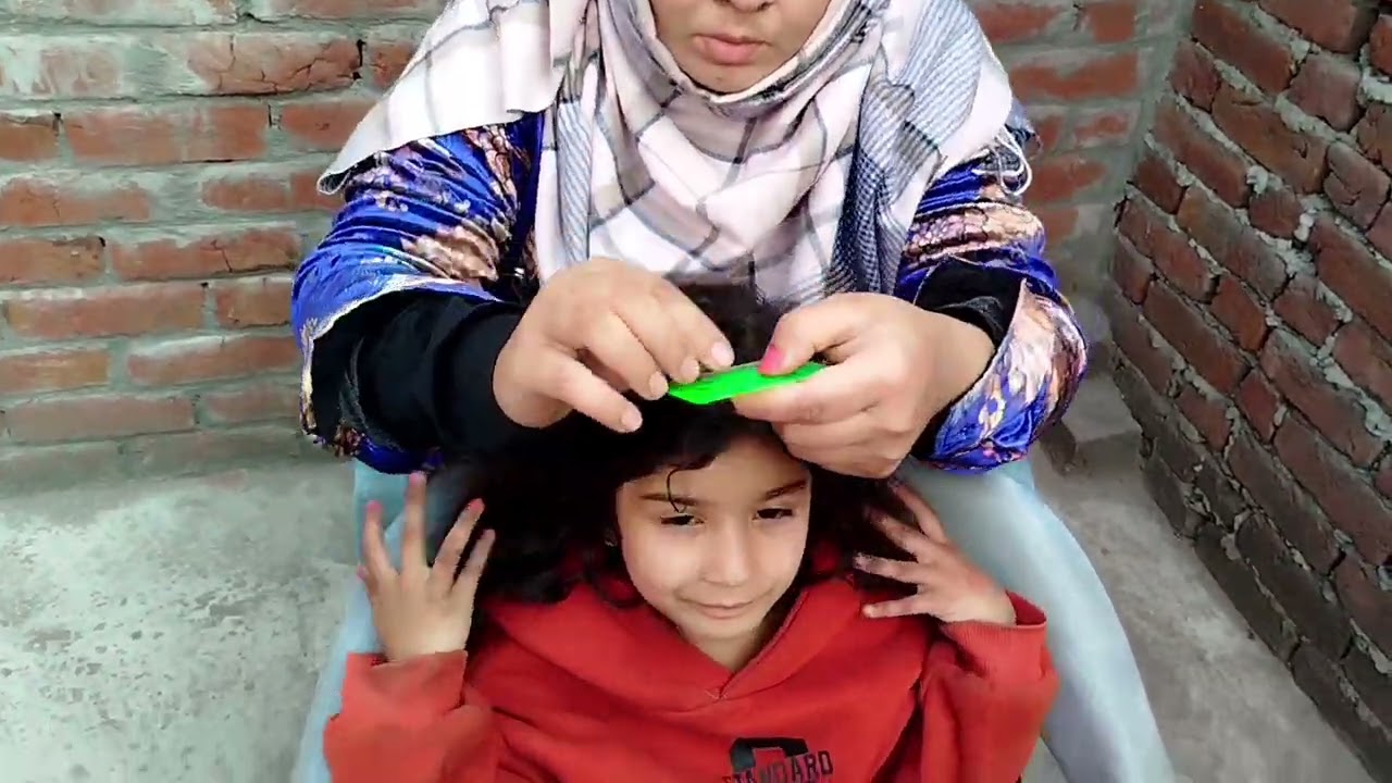 Hair checking of Ashna by mom