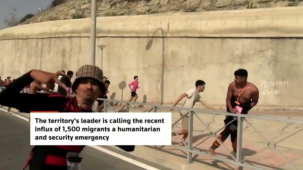 Migrants swim to Spain's Ceuta as city issues emergency
