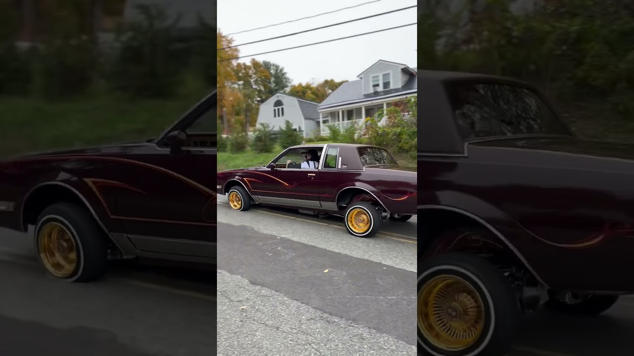 Lowrider Hopping down street 