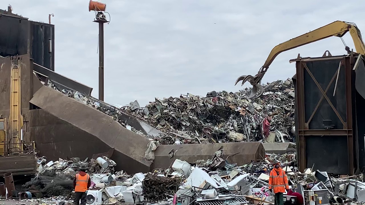 Scrap yard metal yard construction equipment - komatsu excavator - caterpillar - dump trucks
