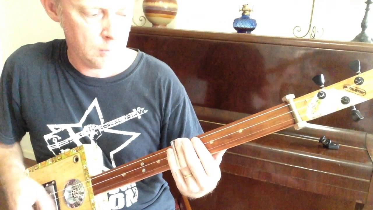 How to play You Shook Me All Night Long on a 3 string Slide cigar box guitar  by Nigel McTrustry