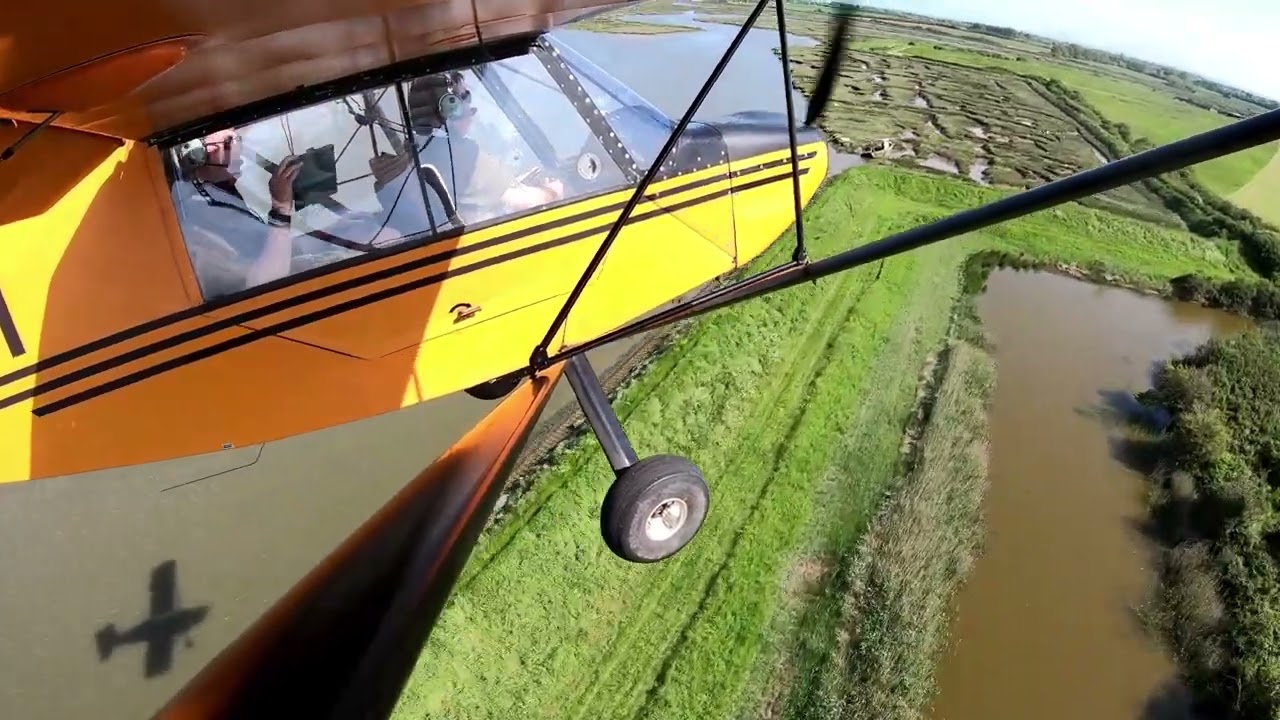 Rans S-7 G-OJKM landing back home at small grass airstrip