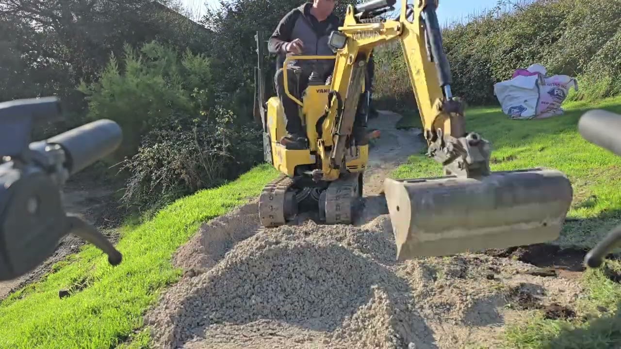 Path way surfacing with yanmar sv08 and muck truck max at  Osmington mills. Dorset fencing