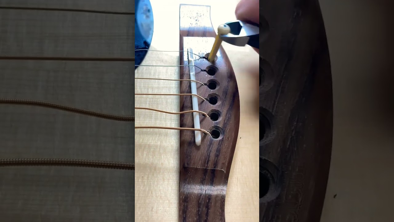 Restringing a guitar in 60 seconds