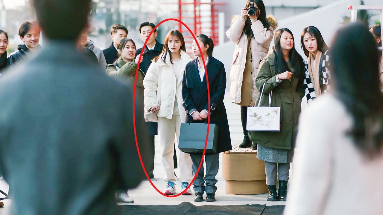 The husband and his mistress show off their affection in public, but the wife is in the crowd!