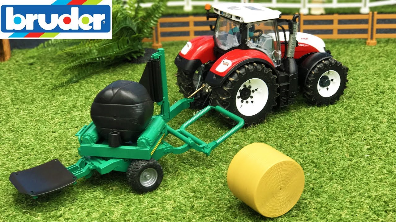 BRUDER TOYS farming - tractor Steyr and balewrapper in action video for kids!