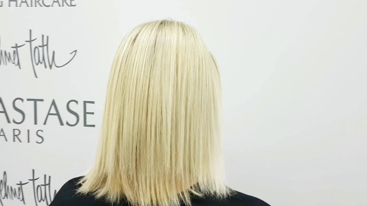 Achieving Platinum Blonde Effect on Hair with Professional Highlighting Application