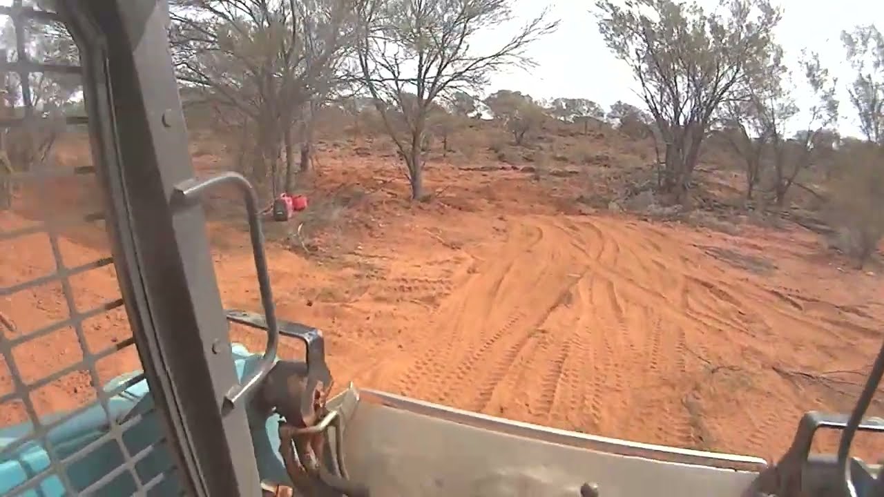 Engine Guard - installed on a ute and a loader. Plenty of dust and a lucky emu. Engine Guard on ROPS