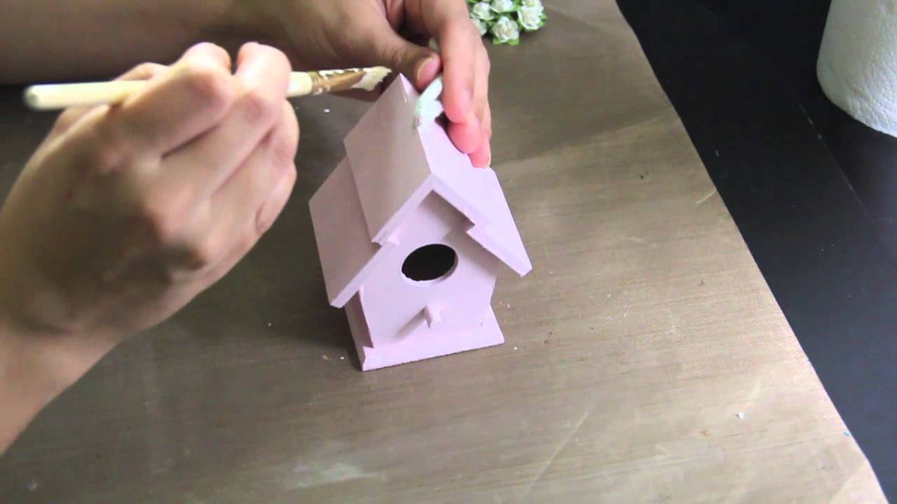 Altered wooden birdhouse.