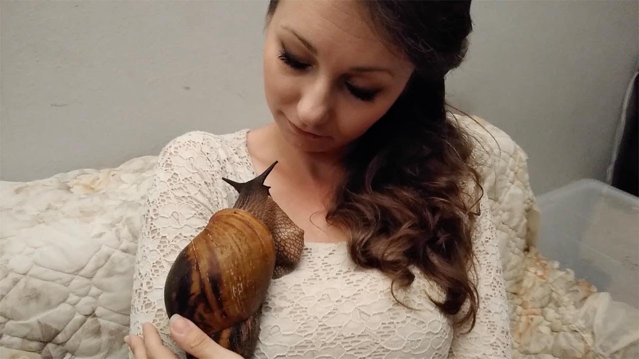 Woman Cuddles Giant Pet Snail