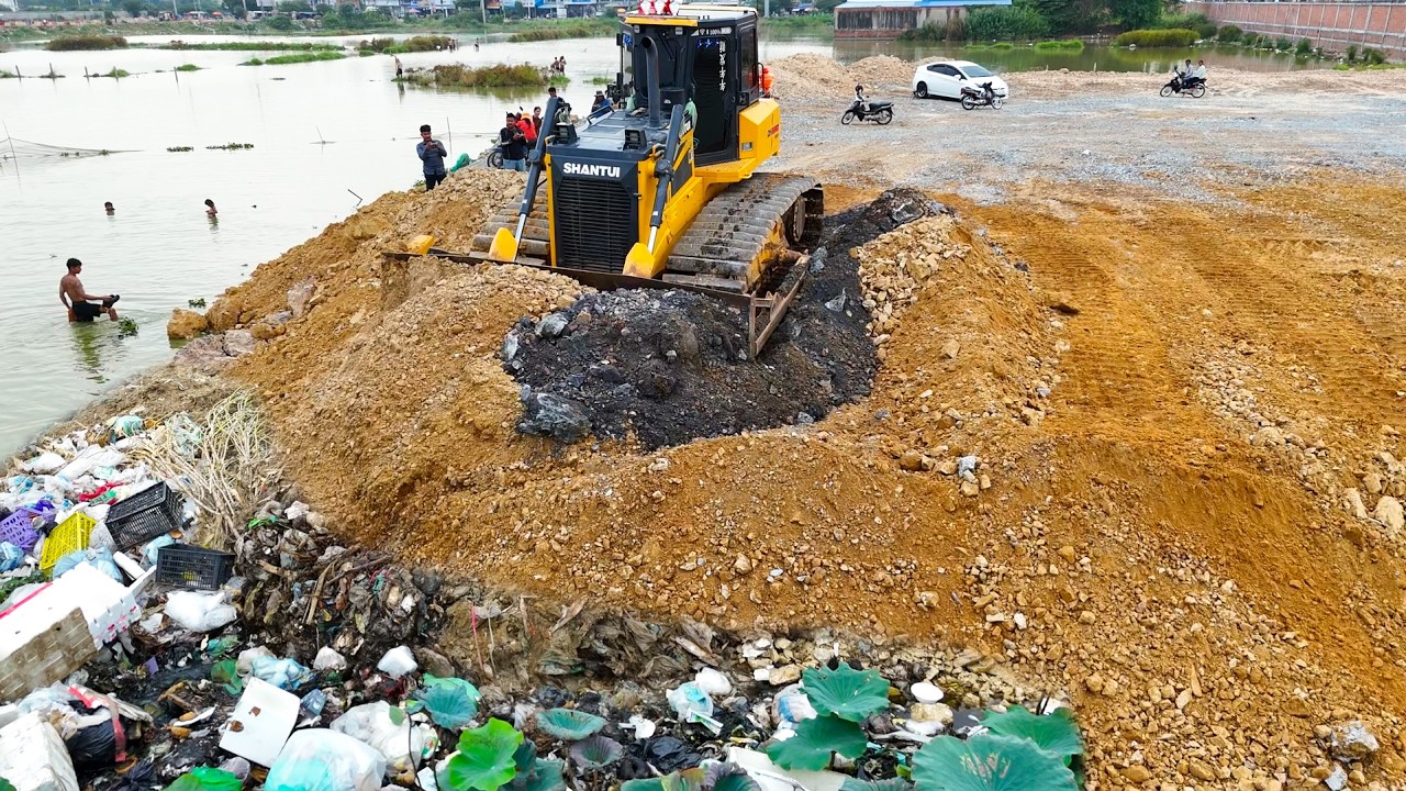 OMG!! Shantui Dozer Pushing Soil Into Garbage Lake While People Fishing Nearby.