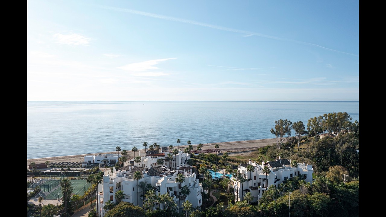 Experience this sophisticated beachfront apartment in Estepona offering direct access to the beach