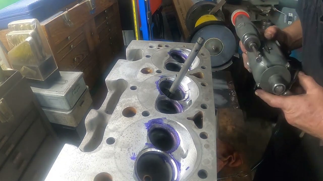 Facing the valves and grinding valve seats