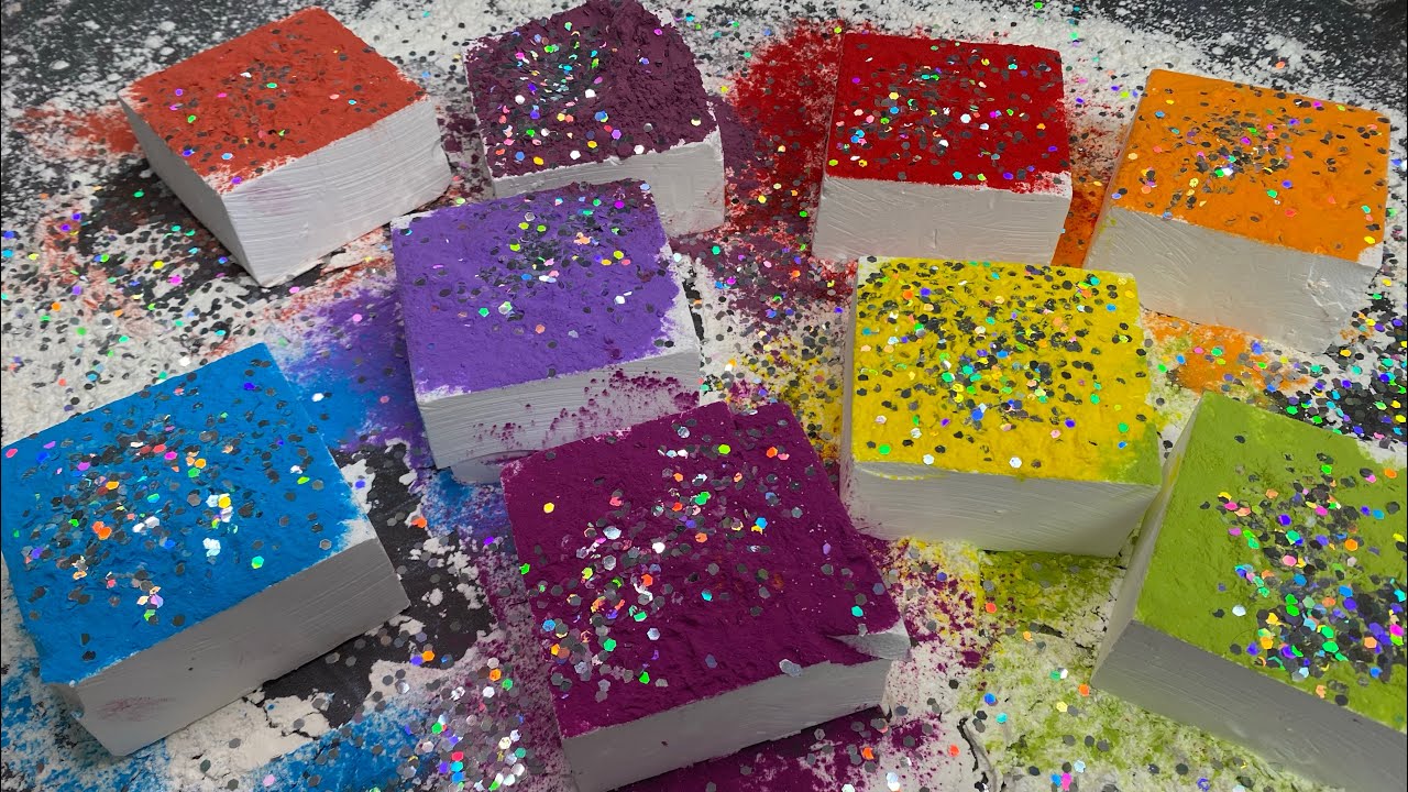 Multi colored pigment over fresh chalk blocks.