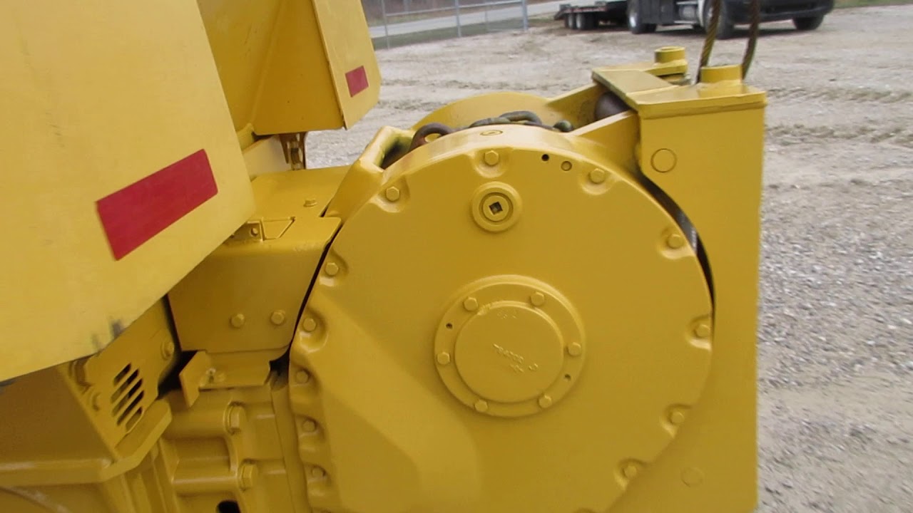 2014 John Deere 550K with winch and Root rake  C&C Equipment