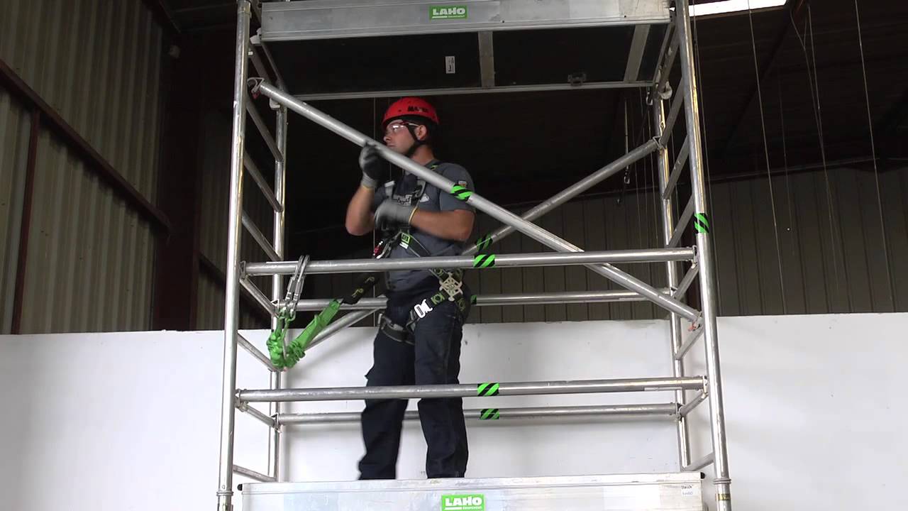 Energy absorbing fall arrest lanyard on scaffolding