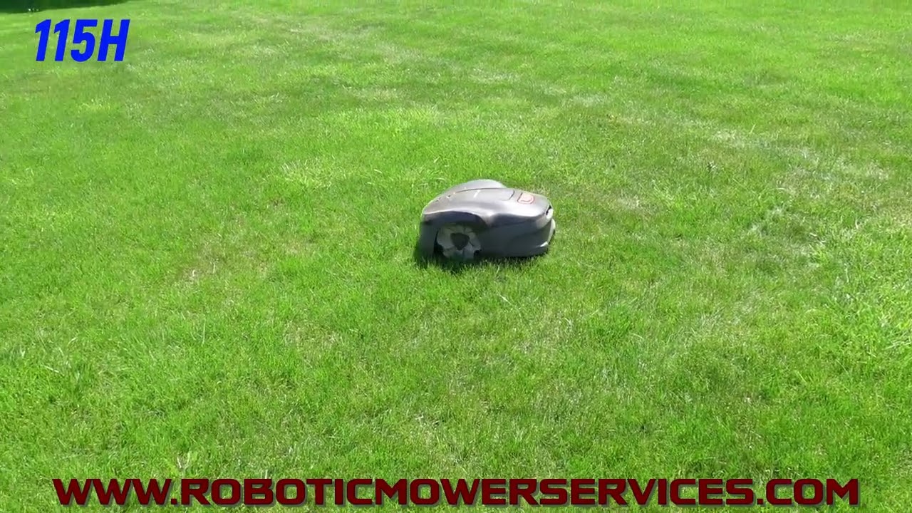 Husqvarna 115H Automower Cutting Grass
