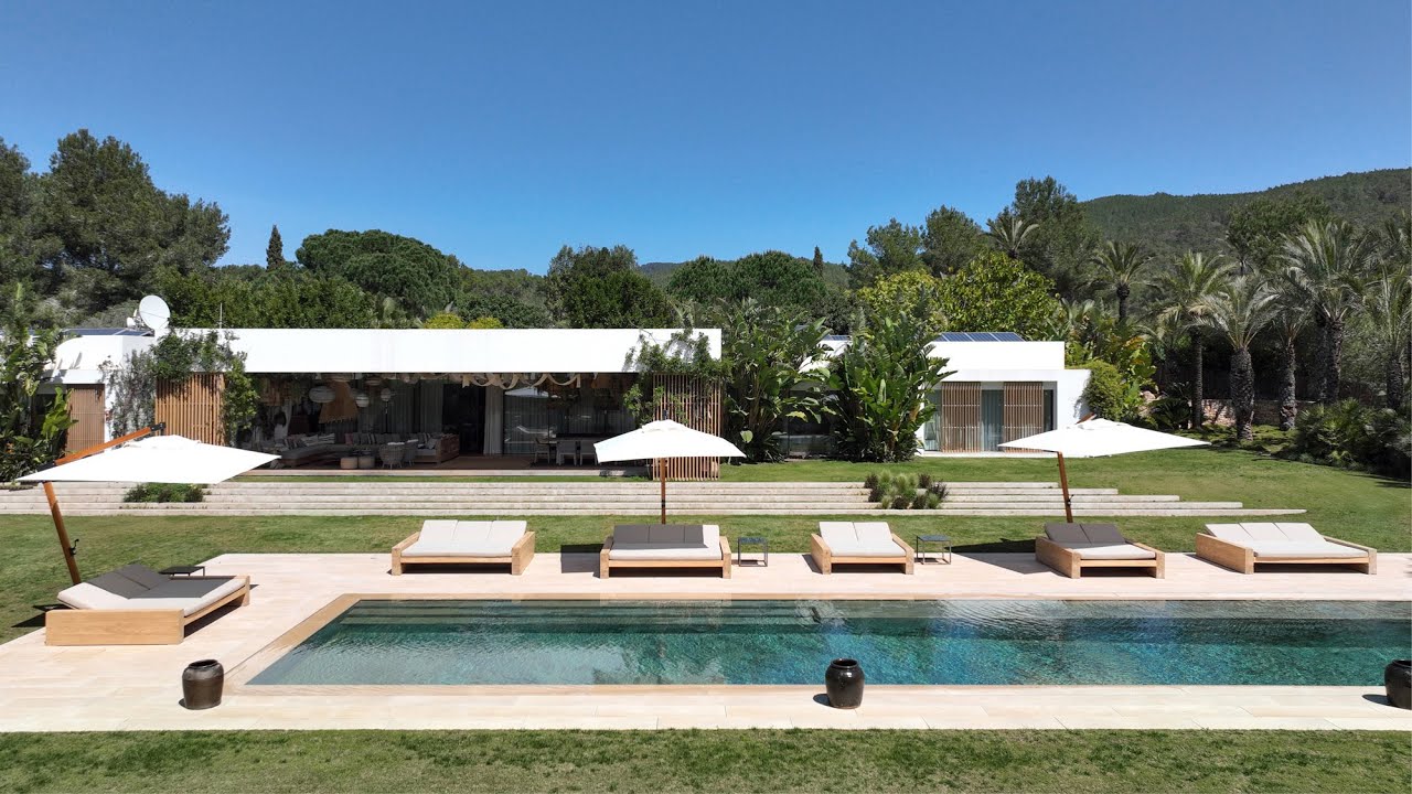 To rent, this modern Ibiza villa is framed by ten lush acres of land