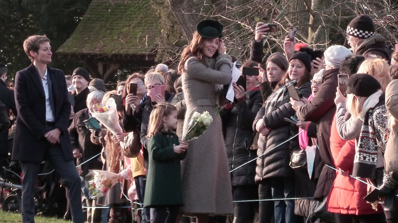 Watch Princess Charlotte refuse to let go of her flowers. Royal Family Attend Christmas Day Service