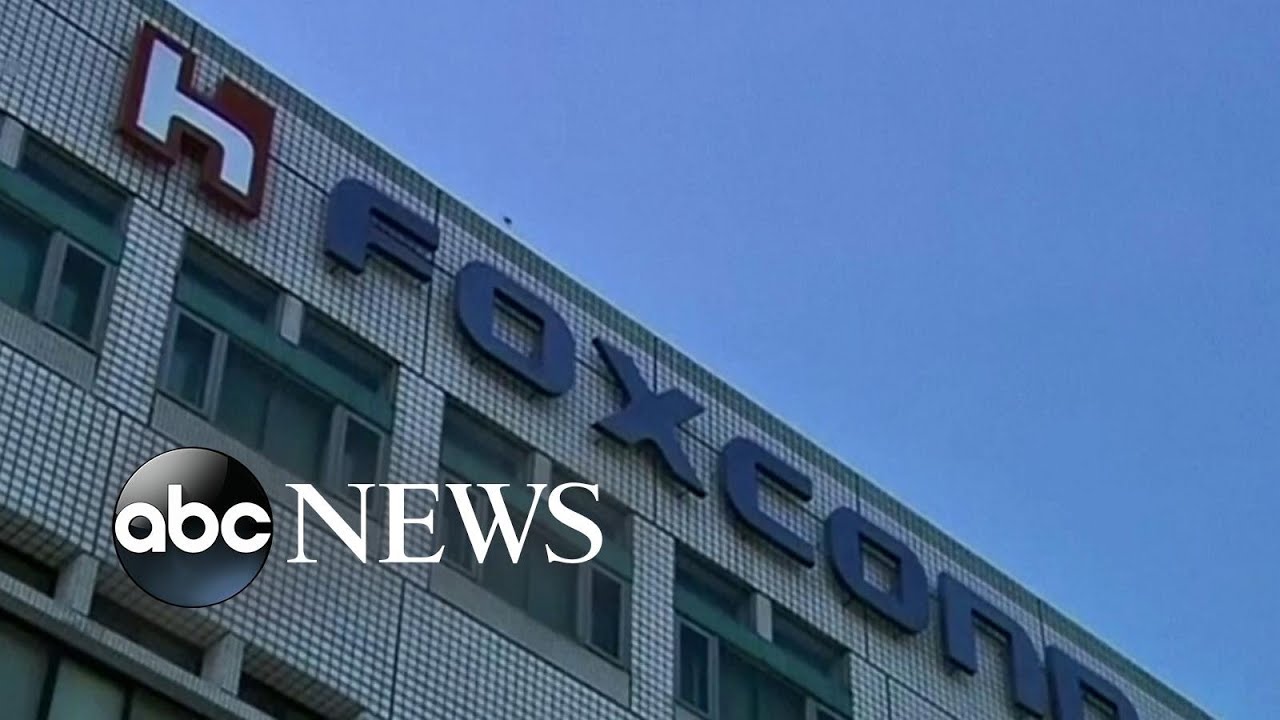 Workers clash with police at Foxconn factory in China l ABC News
