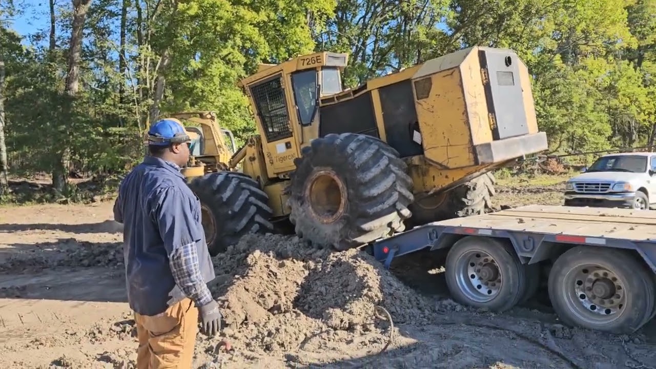 Tigercat 726E Getting Man Handled On Low Boy