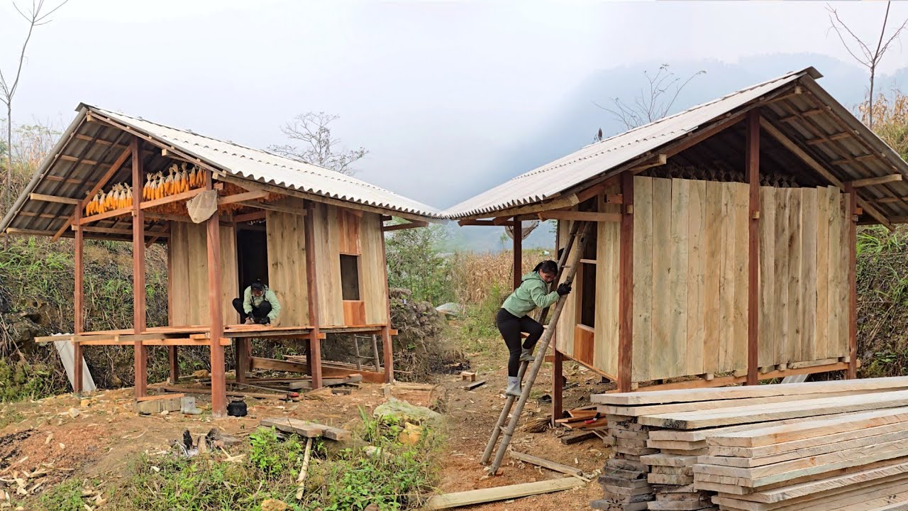 The woman built a partition for her wooden house in the forest. Lý Thương country life