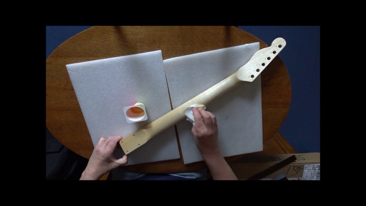 Neck preparation on a Coban Guitars Telecaster kit guitar, waterslide decals, and boiled linseed oil