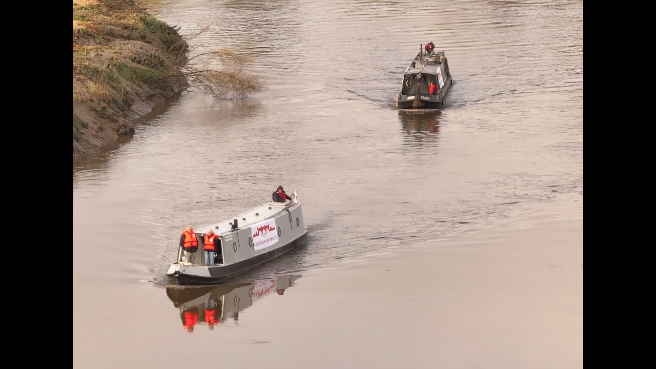 Narrowboats  In procession On the River Trent
