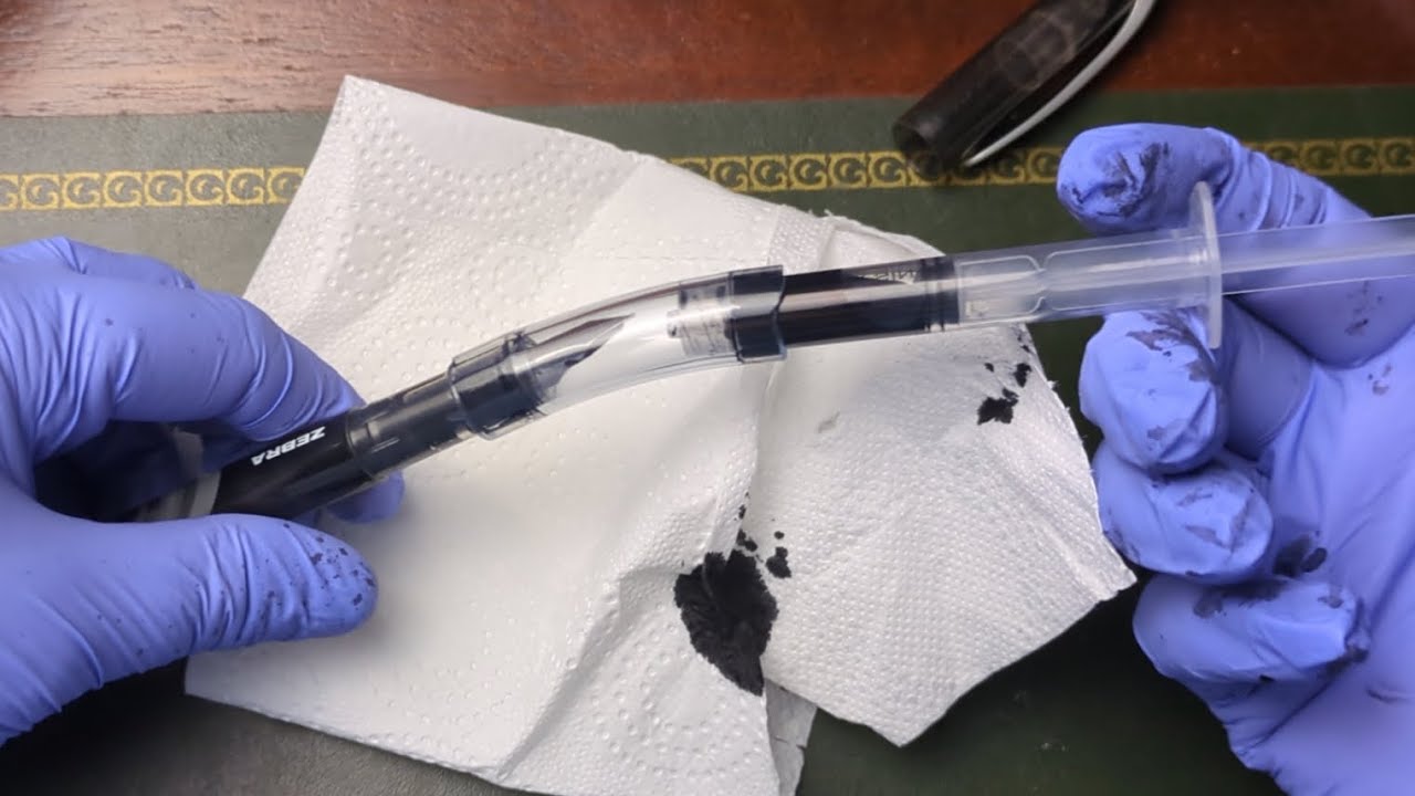 Refilling disposable fountain pens using the vacuum method
